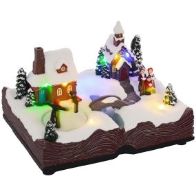 Pueblo navideño con base de biblia abierta, luces LED, música y patinadores giratorios 23x18x15 cm multicolor