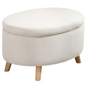 Puff de almacenaje ovalado tapizado en terciopelo beige 71x51,5x42 cm con patas de madera maciza