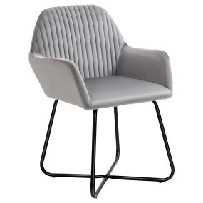 Butaca de salón tapizada en terciopelo gris con asiento acolchado y base metálica cruzada