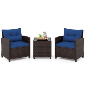 Conjunto de 3 piezas de ratán con mesa de cristal templado y cojines azul marino