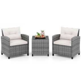Conjunto bistró exterior 3 piezas de ratán con mesa de cristal templado y cojines beige